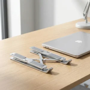 Adjustable Aluminium Laptop Stand — Cooling and Neck Protection — an aluminium stand that raises the laptop for better cooling and a healthier posture, foldable and easy to carry